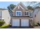 Beautiful two-story home with a two-car garage and well-manicured landscaping at 946 Gardenia Curv, Canton, GA 30114