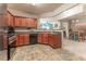 Open kitchen view featuring sleek appliances, dark countertops and adjacent dining area at 946 Gardenia Curv, Canton, GA 30114