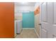 Bright laundry room featuring a washer and dryer, plus colorful accent walls at 946 Gardenia Curv, Canton, GA 30114