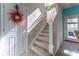 Bright staircase with carpeted steps and white banister, leading to the upper level at 946 Gardenia Curv, Canton, GA 30114