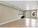Finished basement space with tile flooring, recessed lighting, and a walkout to the backyard at 2002 Stonewick Ct, Lawrenceville, GA 30043