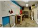 Functional basement workshop area with ample storage, workbench, and a pegboard for organization at 2002 Stonewick Ct, Lawrenceville, GA 30043