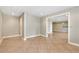 Spacious basement with tile floors and access to other rooms, offering ample space for customization at 2002 Stonewick Ct, Lawrenceville, GA 30043