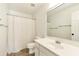 Bathroom featuring a single vanity, toilet, shower with a curtain, and a large mirror at 2002 Stonewick Ct, Lawrenceville, GA 30043