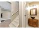 Basement bathroom featuring a vessel sink with granite countertop and decorative framed mirror at 2002 Stonewick Ct, Lawrenceville, GA 30043
