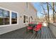 Back deck with table and seating, perfect for enjoying the view and outdoor space of the home at 2002 Stonewick Ct, Lawrenceville, GA 30043