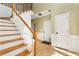 Bright foyer with a staircase, tile flooring, and neutral paint at 2002 Stonewick Ct, Lawrenceville, GA 30043