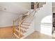Spacious foyer with hardwood stairs and bright lighting at 2002 Stonewick Ct, Lawrenceville, GA 30043