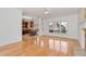 Inviting living space with hardwood floors, fireplace, and large windows overlooking the outdoor scenery at 2002 Stonewick Ct, Lawrenceville, GA 30043