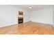 Bright living room features hardwood floors and a cozy fireplace, perfect for relaxing and entertaining at 2002 Stonewick Ct, Lawrenceville, GA 30043