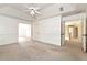 Bright main bedroom boasts tray ceilings, neutral tones, and seamless access to a private hallway and other rooms at 2002 Stonewick Ct, Lawrenceville, GA 30043