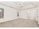 Spacious main bedroom featuring large windows, plush carpeting, and a separate sitting area for added comfort at 2002 Stonewick Ct, Lawrenceville, GA 30043