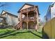 Expansive backyard view showcasing a multi-tiered wooden deck and lush green lawn at 2108 Main Nw St, Atlanta, GA 30318