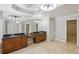 A stylish bathroom featuring -and- sinks, granite countertops, and large mirrors at 2108 Main Nw St, Atlanta, GA 30318