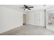 Large carpeted bedroom with a window and closet; neutrally decorated at 2108 Main Nw St, Atlanta, GA 30318