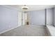 A bright bedroom with neutral carpet, crown molding, and built in seating space at 2108 Main Nw St, Atlanta, GA 30318