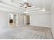 Large carpeted bedroom with a trey ceiling and walk-in to bathroom at 2108 Main Nw St, Atlanta, GA 30318