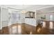 Empty dining room with views of an open kitchen and a bay window at 2108 Main Nw St, Atlanta, GA 30318