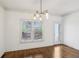 Dining room with wood floors, modern lighting and view of the outdoor deck at 2108 Main Nw St, Atlanta, GA 30318