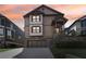 Charming two-story home with a two-car garage and inviting front porch at 2108 Main Nw St, Atlanta, GA 30318