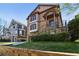 Inviting two-story home with stone accents, manicured landscaping, and driveway at 2108 Main Nw St, Atlanta, GA 30318