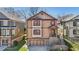 Inviting two-story home with a classic facade, red shutters, and a convenient two-car garage at 2108 Main Nw St, Atlanta, GA 30318