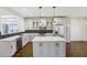 Bright kitchen features stainless appliances, ample counter space, and modern pendant lighting at 2108 Main Nw St, Atlanta, GA 30318