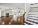 Living room view of the fireplace and stairway with hardwood floors at 2108 Main Nw St, Atlanta, GA 30318