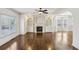 Living room features a fireplace, custom built-ins, and gleaming hardwood floors at 2108 Main Nw St, Atlanta, GA 30318