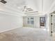 Open main bedroom with trey ceiling, carpet, and walk-out to deck at 2108 Main Nw St, Atlanta, GA 30318