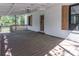 The back porch features wood flooring, wooden shutters, and views of the backyard at 6592 Factory Shoals Sw Rd, Mableton, GA 30126