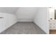 Lofted bedroom features gray carpet floors and connects to a modern bathroom space at 6592 Factory Shoals Sw Rd, Mableton, GA 30126
