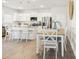 Open-concept kitchen and dining area with island seating and modern decor at 2014 Wyndham Pl, Conyers, GA 30013