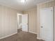 Charming bedroom featuring neutral bead board walls and soft carpeting at 2203 Knoll Dr, Decatur, GA 30032