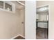 Practical laundry area with washer hookups, shelving for storage, and easy access to the kitchen at 2203 Knoll Dr, Decatur, GA 30032