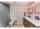 Charming bathroom with double vanity, stylish wallpaper, and modern fixtures, creating a delightful space at 244 13Th Ne St # 302, Atlanta, GA 30309