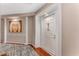 Welcoming entryway with elegant columns, modern art, and a stylish rug leading to the white front door at 244 13Th Ne St # 302, Atlanta, GA 30309