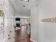 Welcoming entryway with hardwood floors leads into a cozy living area featuring a fireplace and abundant natural light at 244 13Th Ne St # 302, Atlanta, GA 30309