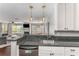 Kitchen featuring a breakfast bar that looks into the living room with a fireplace and hardwood floors at 244 13Th Ne St # 302, Atlanta, GA 30309