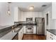 Galley kitchen with granite countertops, stainless steel appliances, and ample cabinet space at 244 13Th Ne St # 302, Atlanta, GA 30309