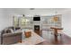 Bright living room featuring a fireplace, large windows, hardwood floors, and stylish furnishings at 244 13Th Ne St # 302, Atlanta, GA 30309