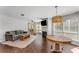Sunlit living room with a cozy sofa, stylish coffee table, fireplace, and hardwood floors at 244 13Th Ne St # 302, Atlanta, GA 30309