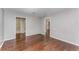 Spacious living room with beautiful hardwood floors with access to the kitchen, bathroom and second bedroom at 244 13Th Ne St # 302, Atlanta, GA 30309