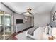 Serene main bedroom with sliding glass door, dresser with decor and neutral decor at 244 13Th Ne St # 302, Atlanta, GA 30309
