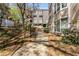 Scenic landscaped path leading to the building, surrounded by lush greenery, offering a peaceful entrance at 244 13Th Ne St # 302, Atlanta, GA 30309