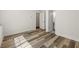 Bedroom showcasing wood floors, white walls, and doors leading to other rooms at 3165 Dogwood Dr # 107, Hapeville, GA 30354
