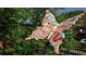 Intricately painted butterfly statue in a park, enhancing the neighborhood's artistic appeal and charm at 3165 Dogwood Dr # 107, Hapeville, GA 30354