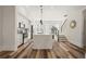 Bright, modern kitchen featuring a large quartz island, stainless appliances, and hardwood floors at 3165 Dogwood Dr # 107, Hapeville, GA 30354