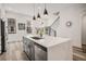 Open concept kitchen with quartz countertops, stainless appliances, and island with breakfast bar at 3165 Dogwood Dr # 107, Hapeville, GA 30354