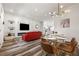 Elegant living and dining area featuring modern furnishings, fireplace, and open kitchen view at 3165 Dogwood Dr # 107, Hapeville, GA 30354